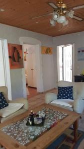 a living room with couches and a coffee table at Villa Behija Ferienwohnung 3 Crikvenica in Crikvenica +10 photos