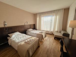 Cama o camas de una habitación en Hotel Truso