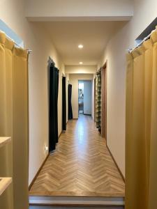 a walk in closet with a long corridor at ゲストハウス and BAR CHITEN in Awaji