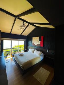 a bedroom with a large bed and a large window at Bocalago in Puerto Nuevo +81 photos