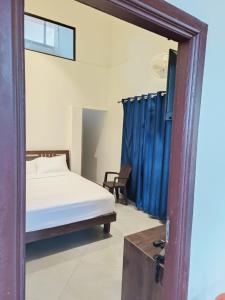 Postel nebo postele na pokoji v ubytování Coorg Vismaya Resort