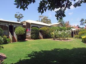 a house with a yard in front of it at Adamsons Riverside Accommodation in Margaret River Town