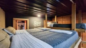 two large beds in a room with at Bucanaan hostel boutique in Córdoba +59 photos
