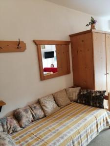 Postel nebo postele na pokoji v ubytování Tana delle Marmotte