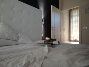 Ein Bett oder Betten in einem Zimmer der Unterkunft Il Poggiolo Delle Rose Bed&Breakfast