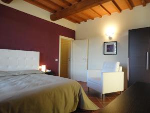 Ein Bett oder Betten in einem Zimmer der Unterkunft Il Poggiolo Delle Rose Bed&Breakfast