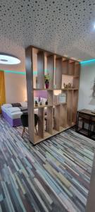 a room with a bed and a book shelf at Studio-Apartment ' Andrei 1 ' - Neu in Neuburg an der Donau in Neuburg an der Donau
