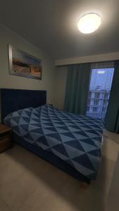 Posteľ alebo postele v izbe v ubytovaní Apartament Holiday 32