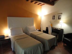 Ein Bett oder Betten in einem Zimmer der Unterkunft Il Poggiolo Delle Rose Bed&Breakfast