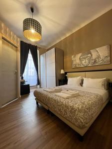Postel nebo postele na pokoji v ubytování Domus La Foce Hotel + 37 fotografií