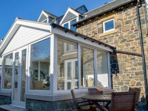 an extension to a conservatory on a house at Aidan Cottage in Craster