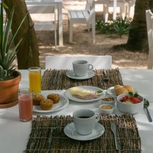 אפשרויות ארוחת הבוקר המוצעות לאורחים ב-Muita Paz Rooms