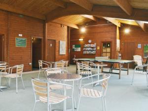 a room with tables and chairs in a building at Blea Tarn in Elterwater