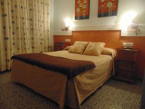 Postel nebo postele na pokoji v ubytování Hotel Sierra de Araceli Lucena