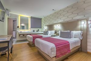 Łóżko lub łóżka w pokoju w obiekcie Kali Ciudadela Mexico City
