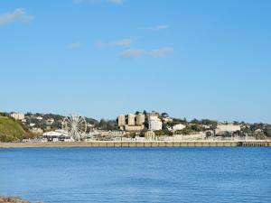 a large body of water with a city in the background at Champernowne in Darlington