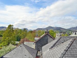 a group of roofs with mountains in the background at 5 Balmoral House in Keswick