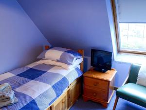 Posteľ alebo postele v izbe v ubytovaní Culcharry Cottage