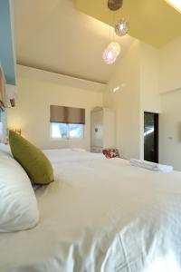מיטה או מיטות בחדר ב-Taroko Bay B&B