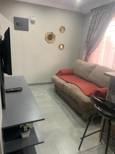 a living room with a couch and a table at The Villa 442 in Pretoria