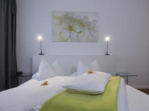 Postel nebo postele na pokoji v ubytování Gartenstadt Hotel
