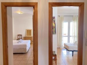 Postel nebo postele na pokoji v ubytování Milenio 1H Apartments Casasol