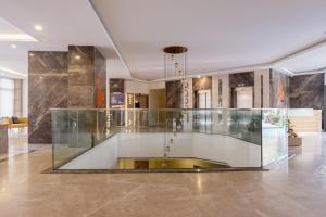 a glass exhibit in a room with a ceiling at 5 Star Hotel Concept Apartments with Spa and Sport Center in Esenyurt