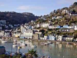 a harbor with boats in the water in a town at Kerensa in Looe
