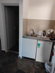 a small kitchen with a sink and a counter at Kea Island II in Korissia