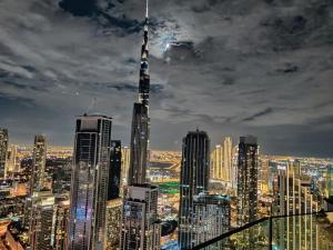 a view of a city skyline with the tallest building at Paramount Hotel Midtown Flat with Burj Khalifa View in Dubai