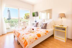 a bedroom with a bed with two teddy bears on it at Erica perfect central location near beach in Novalja
