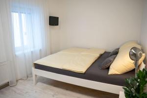 A bed or beds in a room at Byt Krenova 1+kk