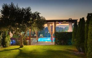 a backyard with a swimming pool and a pergola at Villa Fay Split in Split