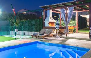 a swimming pool with a fireplace in a backyard at Villa Fay Split in Split +37 photos