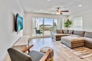 a living room with a couch and a table at Madeira Del Mar 305 in St Pete Beach