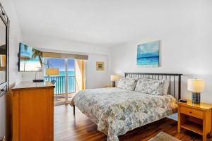 a bedroom with a bed and a view of the ocean at Villa Madeira 505 - Premier in St. Pete Beach +51 photos