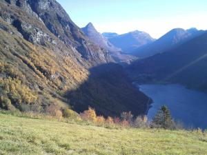a view of a mountain valley with a lake at Lunheim in Geiranger in Geiranger