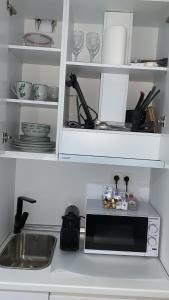 A kitchen or kitchenette at VEROMA PISOS