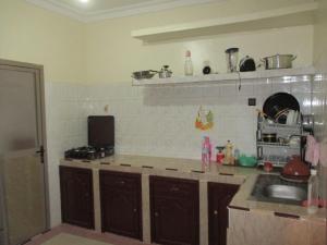 a kitchen with a sink and a counter top at إقامة وادي الذهب in Dakhla