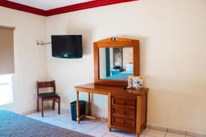 TV a/nebo společenská místnost v ubytování Hotel Gina