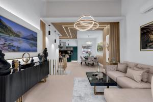 a living room with a couch and a table at The Luxury Goldenhour in Makarska