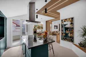 a kitchen with a large island in a room at The Goldenhour Apartment in Makarska