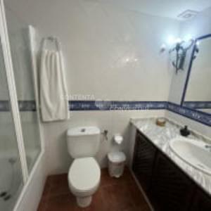 a bathroom with a toilet and a sink and a shower at Apartamentos Turísticos La Posada in Oropesa