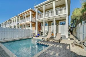 a house with a swimming pool in front of a house at Amzg Gulf view,4 Bd/3.5 Bath Home, Pvt heated Pool in Panama City Beach