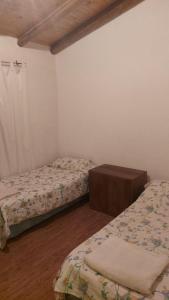 Una cama o camas en una habitación de Casa San Rafael Mendoza