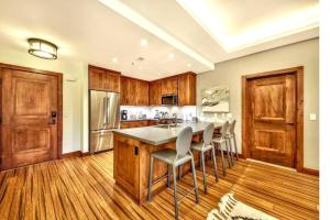 a kitchen with a large table and chairs in it at Ski In/Out - Zalanta - Great Location- 2 Hot Tubs - Heated Pool in South Lake Tahoe