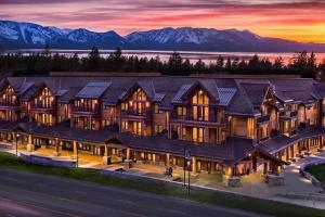 an aerial view of a large house with mountains in the background at Ski In/Out - Zalanta - Great Location- 2 Hot Tubs - Heated Pool in South Lake Tahoe
