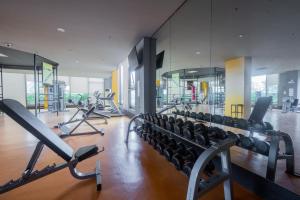a gym with cardio equipment in a building at The Radiance Manila Bay in Manila