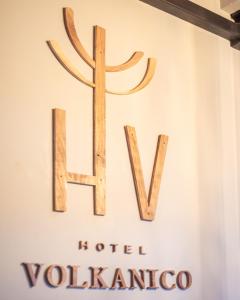 a sign for the hotel vollezlez is displayed at the fendi store at HOTEL VOLKANICO in Curacautín