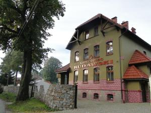 a building with a sign on the side of it at Gościniec Rudawski in Kamienna Góra